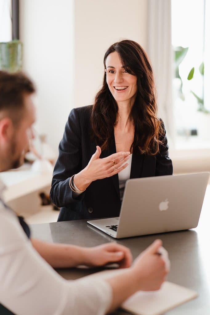 A Regainr specialist talking a client through their case